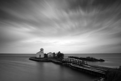 Scenic view of sea against cloudy sky