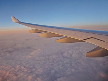 Airplane wing against sky