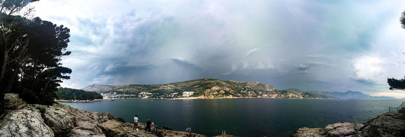 Scenic view of sea against cloudy sky