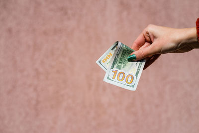 Close-up of hand holding paper