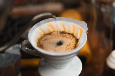 Close-up of cappuccino on table