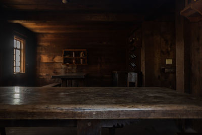 Empty chairs and table in building