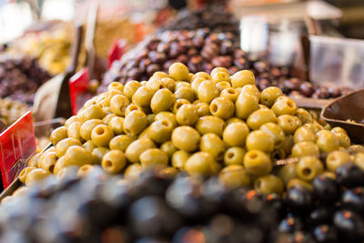 Close-up of olives for sale at market stall