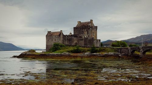 View of castle against cloudy sky