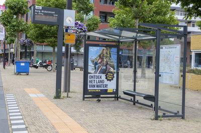 Text on footpath by street in city