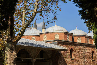 Exterior of historic mosque against sky