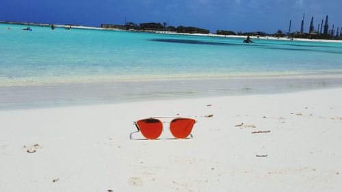 Scenic view of beach against blue sky