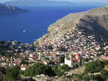 High angle view of townscape by sea