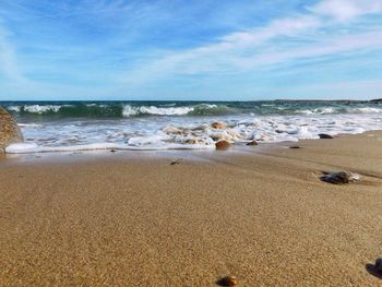 Scenic view of beach against sky