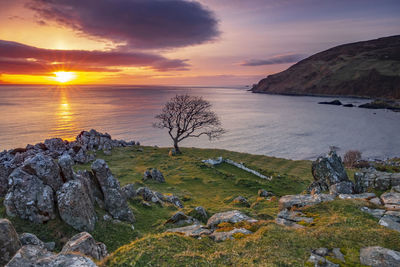 Scenic view of sea against sky during sunset