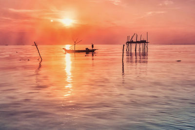 Scenic view of sea against sky during sunset