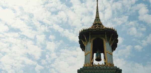 Low angle view of bell tower against sky