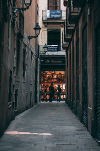 People walking on sidewalk in city