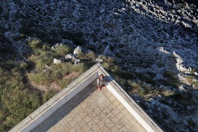 High angle view of people on rock