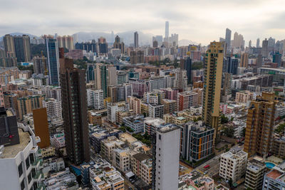 High angle view of modern buildings in city against sky
