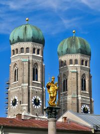 Low angle view of statue of building against sky