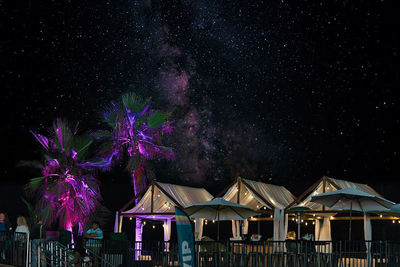 Low angle view of firework display at night