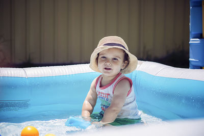 Full length of cute girl in swimming pool