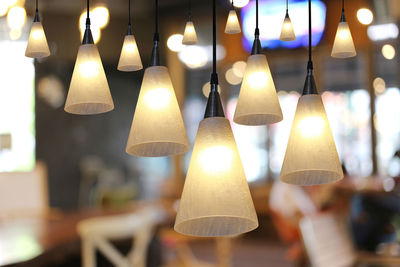 Close-up of illuminated pendant lights at home