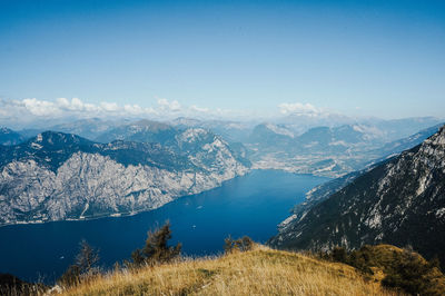 Scenic view of mountains against blue sky