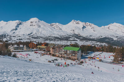 Scenic view of snowcapped mountains against clear sky