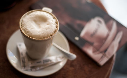 High angle view of coffee cup on table