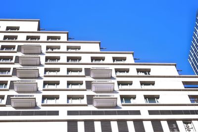 Low angle view of building against blue sky