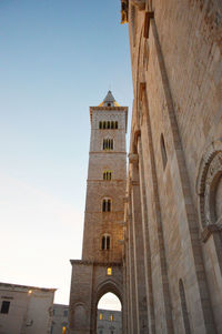 Low angle view of clock tower against sky