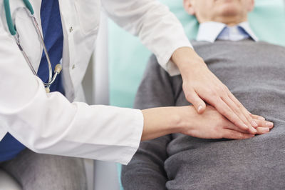 Midsection of man with hands