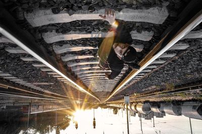 Woman with illuminated lighting equipment at night
