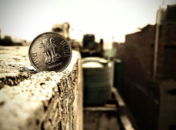 Close-up of coins on metal