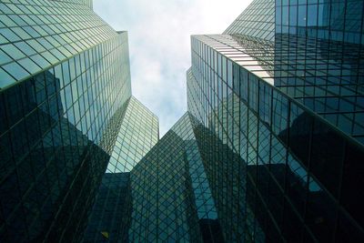 Low angle view of skyscrapers against sky