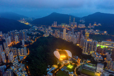 High angle view of city lit up at night