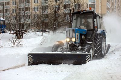 Horse cart in snow covered building