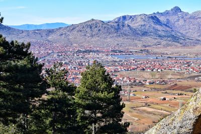 Scenic view of trees and mountains against sky