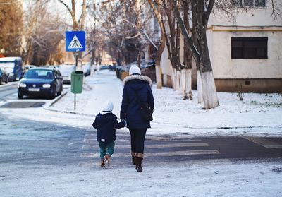 Full length of man walking in snow