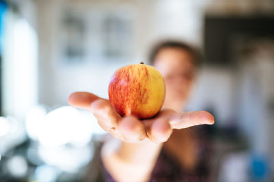 Close-up of person holding apple