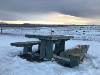 Scenic view of frozen sea against sky during winter