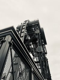 Low angle view of ferris wheel against sky