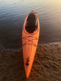 Kayak by the water on the beach