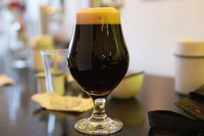 Close-up of beer glass on table