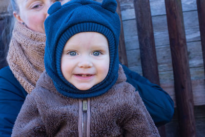 Mother and son. portrait of cute  baby boy watching at camera and smiling.