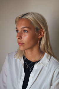 Portrait of beautiful young woman looking away