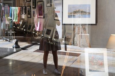 Reflection of woman on window