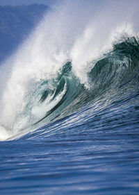 Close-up of waves in sea against sky