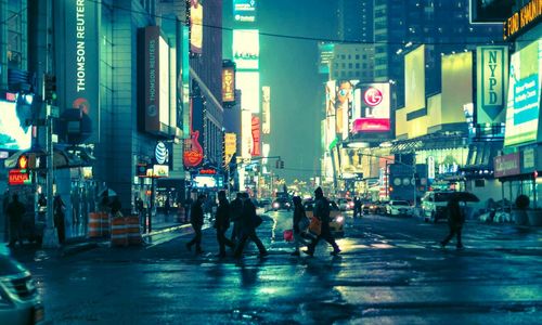 People walking on road at night