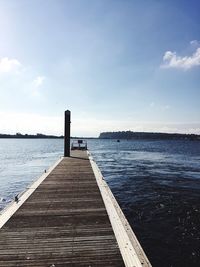 Pier over sea against sky