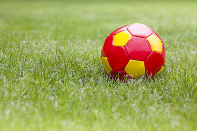 Close-up of soccer ball on field
