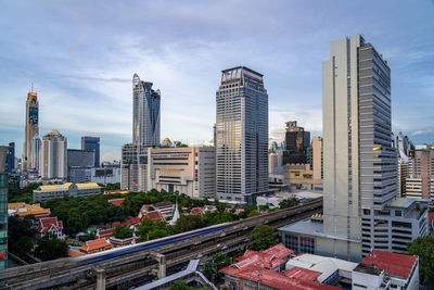 Bangkok, thailand - 10 august 2022 - aerial view of bangkok cityscape high-rises and bts skytrains