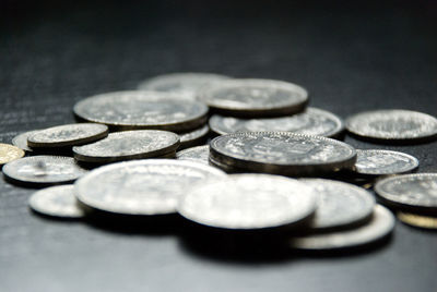 Close-up of coins on table